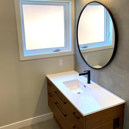 _Meuble-lavabo moderne avec miroir rond – Constructions RMF